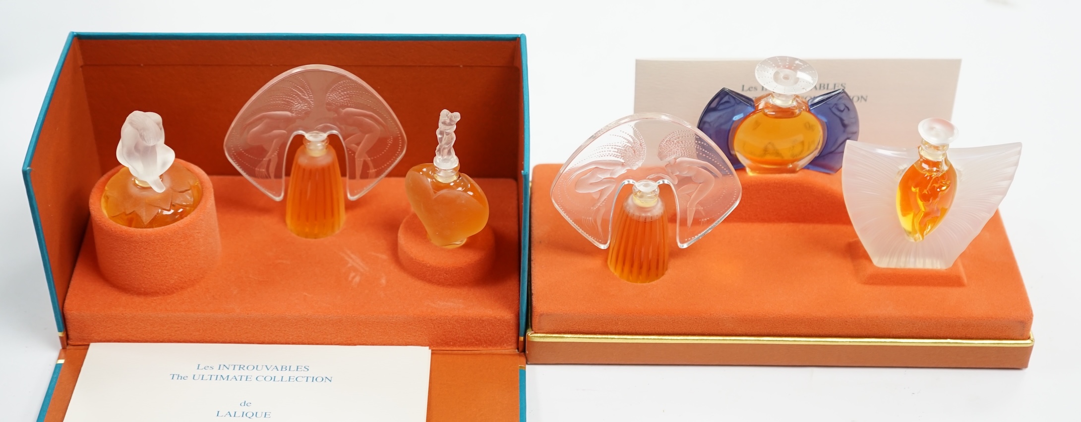 Two Lalique sets of three miniature perfume bottles. 'Les flacons miniatures' 1996-1997 and 1998-2000, boxed and sealed, tallest 7cm high. Condition - good